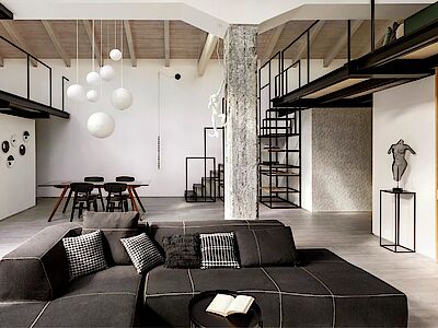 Un moderno loft black e white rivestito con piastrelle in gres porcellanato